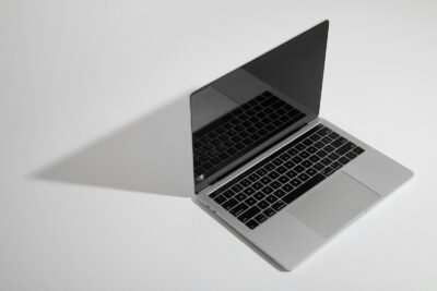 macbook pro on white table